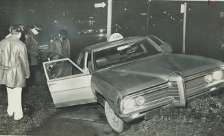 Cab No. 187 - its driver was knifed, Taxicab number 187 is examined by detectives at corner of Tyndall and Thorburn Aves., in Toronto's west end, afte(...)