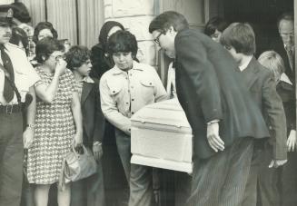 Coffin of slain shoeshine boy Emanuel Jaques is carried from St