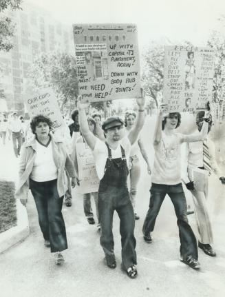 Marchers assemble at Queen's Park during recent rally against body rub shops on Yonge St