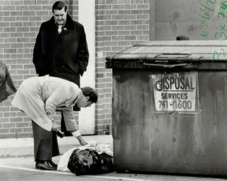 Body found: The body of a man, stuffed into a garbage bag with hands bound behind his back, was found next to a disposal bin yesterday in the Finch West Mall at Weston Rd