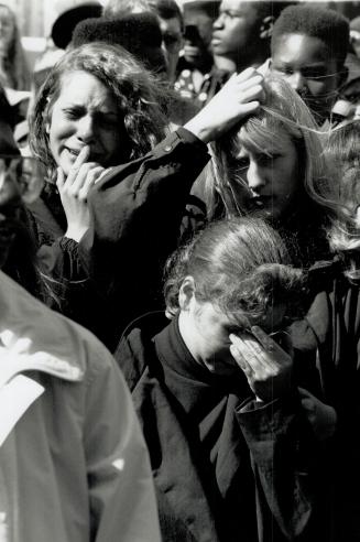 Farewell to a friend: Tearful mourners say goodbye to Kareem O'Brien outside Jami Mosque in Toronto where his funeral was held yesterday