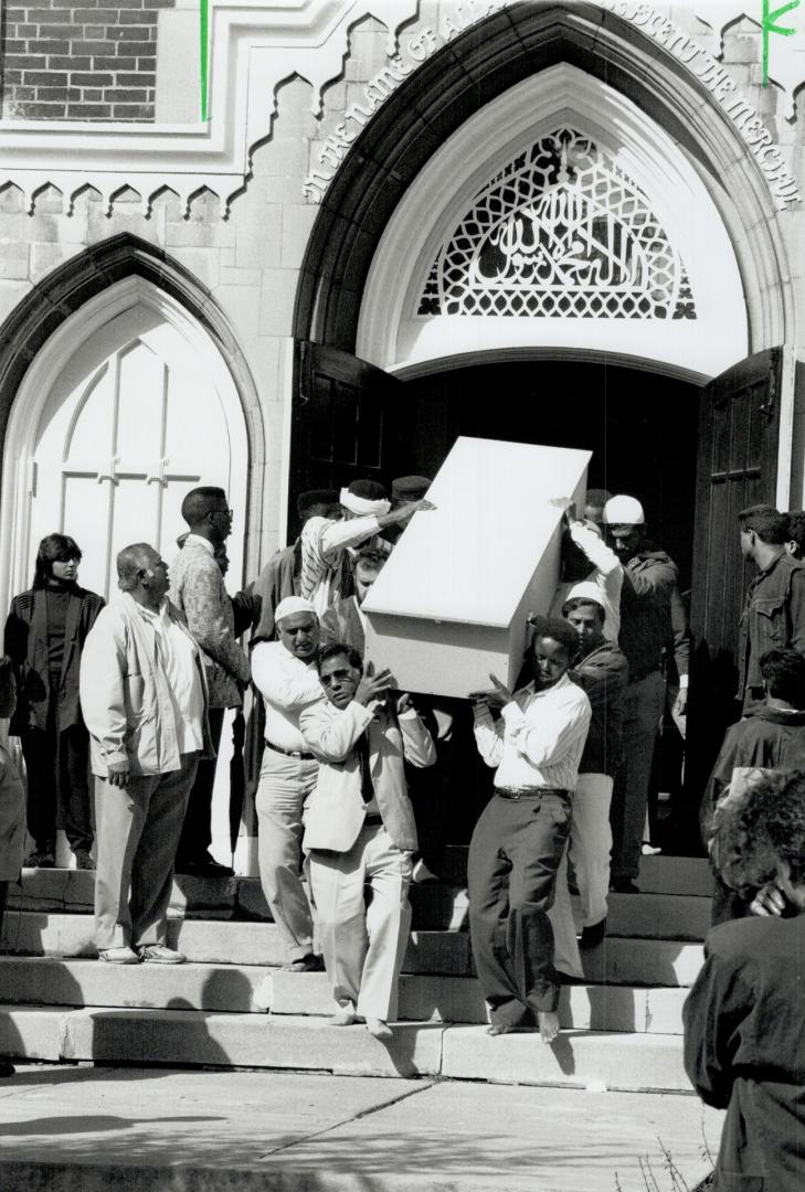 Last Journey: Pallbearers carry the casket of Kareem O'Brien from Jami Mosque after his funeral yesterday