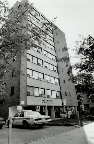 Cordoned off: Police seal site of yesterday's fatal plunge to question witnesses - including one who says man was definitely thrown out of window