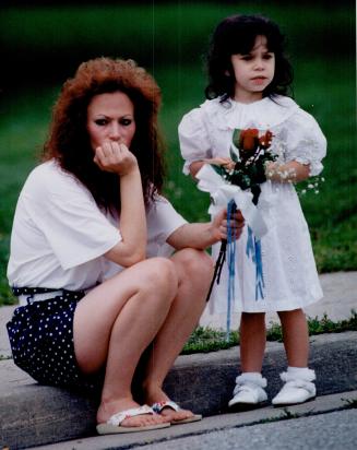 Heather Nelson - Grande with daughter Nicole, 3, watching cortage