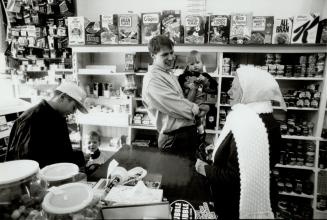 Last goodbye: The family of Osyp (Joe) Kawun say goodbye to a customer at the Annette Food Market yesterday