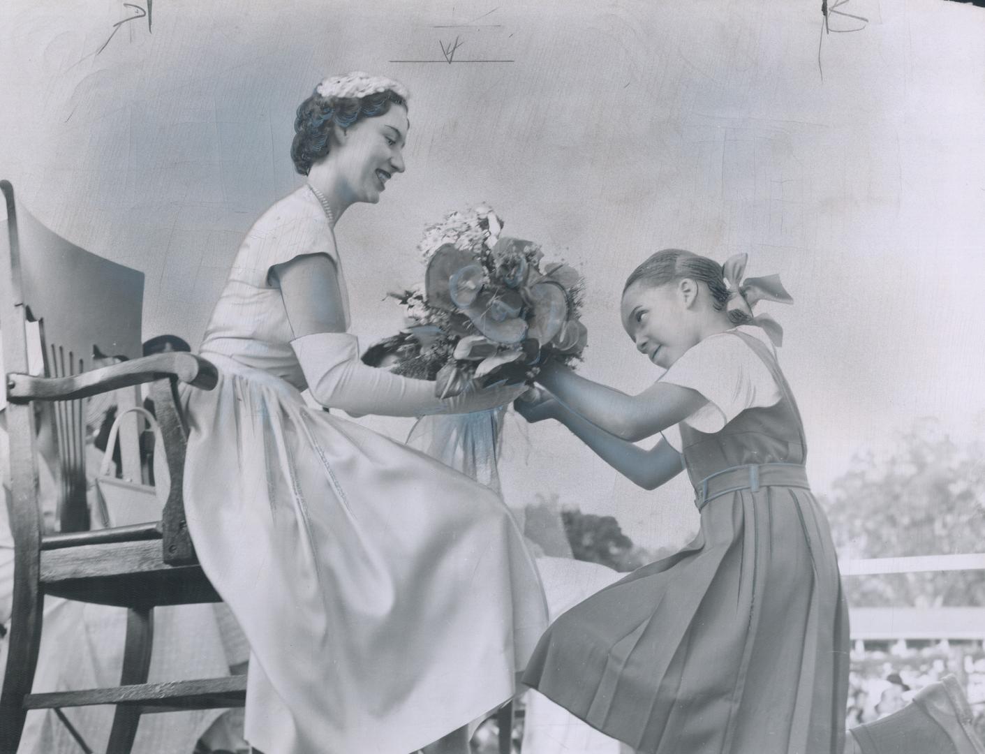 A little girl presents a bouquet at Kingstown, St