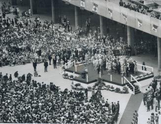 Thousands jam Nathan Phillip Square today to hear the Queen praise Toronto as a progressive city which has not lost its human scale