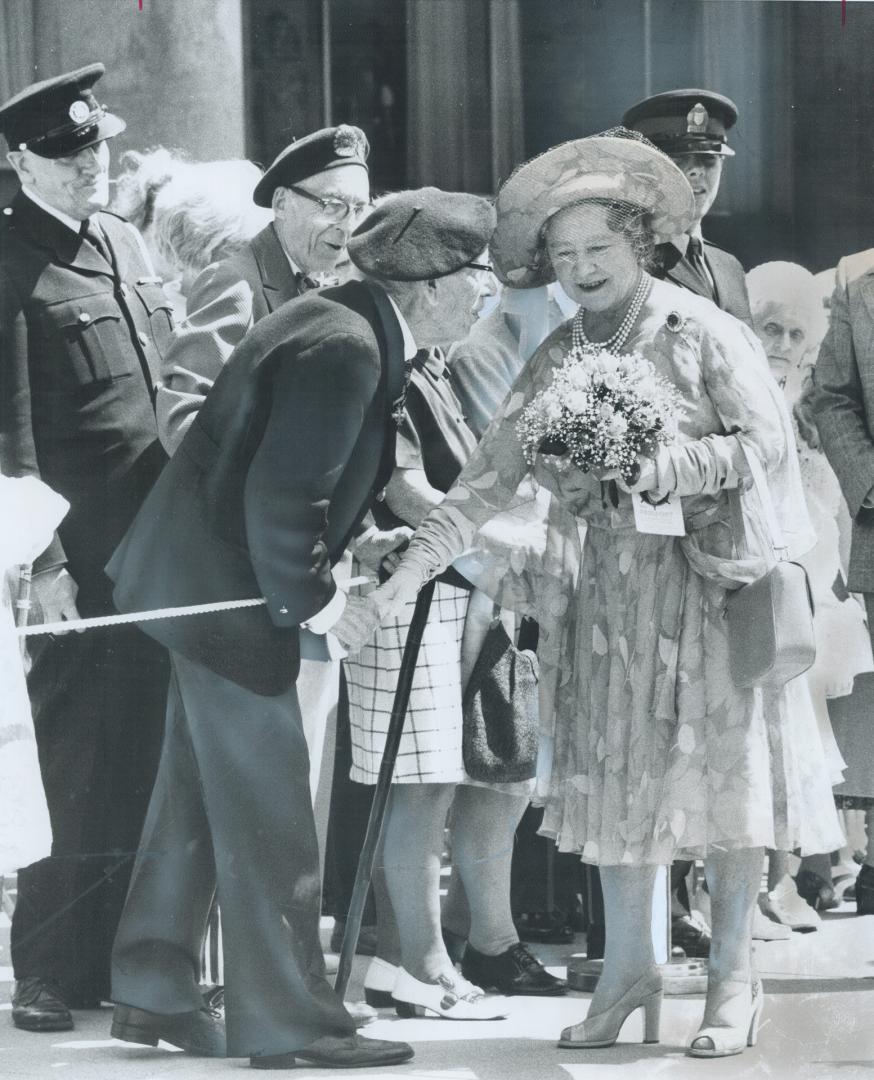 Queen Mother Elizabeth stops to chat with veterans on her walk from City Hall to Osgoode Hall during her Toronto visit