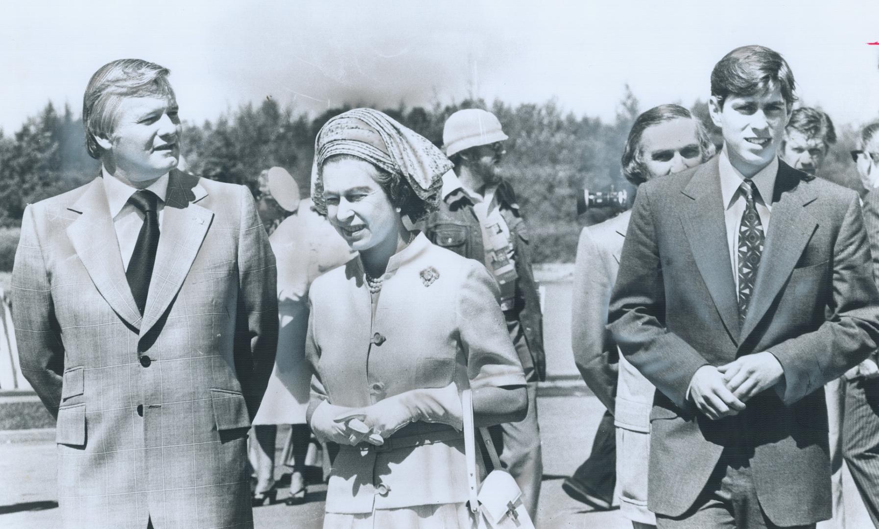 Queen Elizabeth, above, with Premier William Davis and Prince Andrew during last year's royal tour