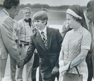 Youngest son of the Queen, 14-year-old Prince Edward, shakes hands with Saskatoon Mayor Clifford Wright yesterday on the royal family's arrival in the(...)