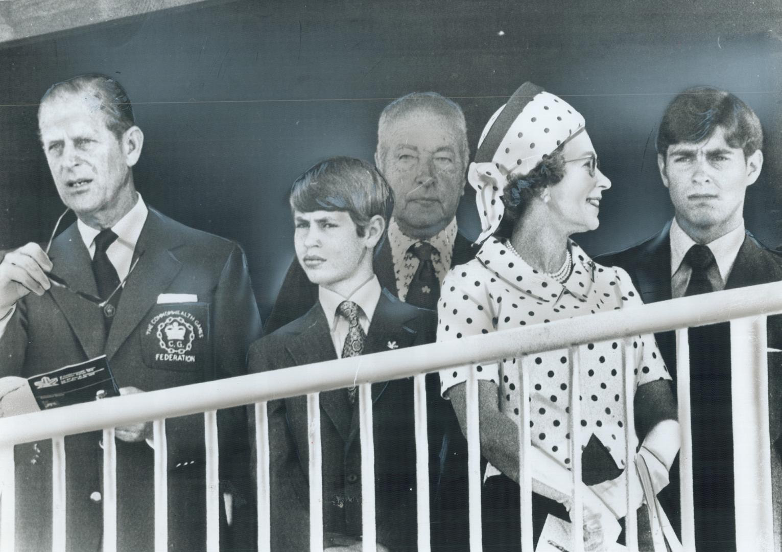 Something else seems to have caught the Queen's eye while Prince Philip, Prince Edward and Prince Andrew concentrate on lawn bowling. A lawn-bowling official stands behind