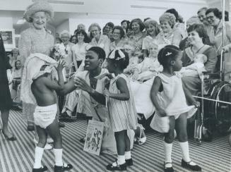 Look, Mum - no clothes!, Quadruplets Lisa, Layla, Linda and Laura Remy, aged 4, were supposed to greet the Queen Mother at Women's College Hospital yesterday