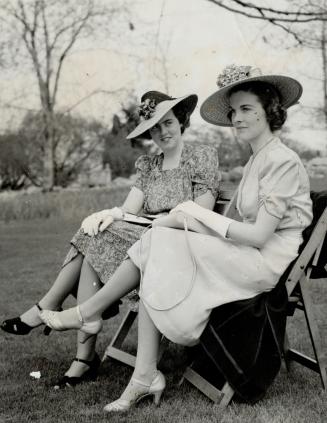 Barbara and Audrey fellowes, Ottawa socialites, were snapped together during the most exciting garden party Canada has ever held. The King cut and sampled his birthday cake