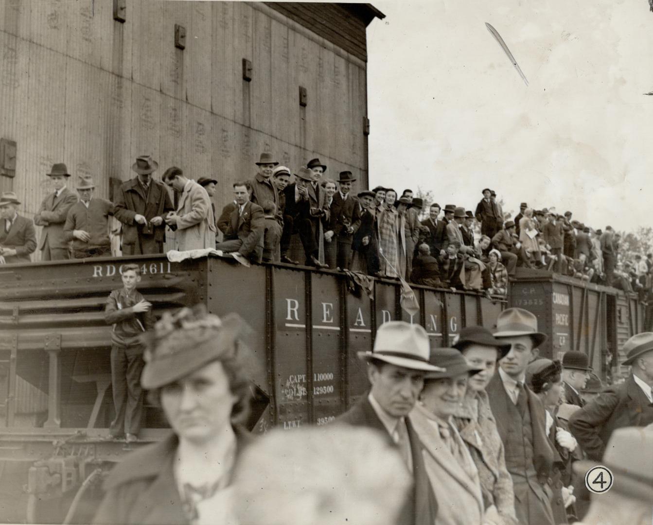 These camera shots show spectators at various points in their majesties progress today