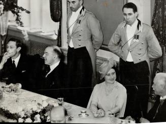 The king smokes a cigarette after luncheon in Quebec city, shortly before making his first address on Canadain soil