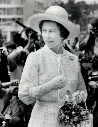 The Queen is right-up-to-the-minute in fashion in her off-the-face hat with wide rolled brim