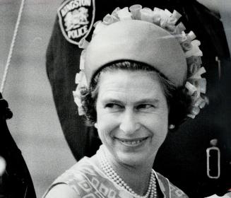 Pillbox hat worn on the back of the head is a favorite with Queen Elizabeth, she must wear hats that reveal her face to the crowds while she is on view to the public