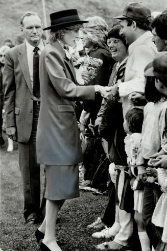 Royal handshake: Almost the entire population of Bridgewater, on Nova Scotia's South Shore, turned out yesterday to welcome Prince Charles and Princess Diana to their small town