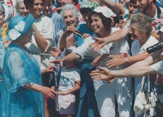 Queen Elizabeth, the Queen Mother, charms her admirers yesterday at Queen's Park just as she did Canadians 50 years ago during her first visit. Althou(...)