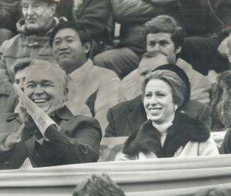 Football fans: Princess Anne and Fitness Minister Steve Paproski enjoy the Canadian College Bowl football championship at Varsity Stadium yesterday