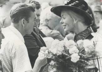 The Duchess of Kent is asked by spectator John Sinclair for a carnation from her bouquet - and hands him one - after she officially launched Metro's U(...)