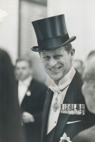 Prince Philip officially opened the Royal Winter Fair by raising the Canadian flag after a short address and then settled down in the Royal Box to enj(...)