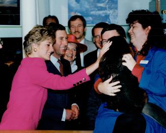 Needjee, an 18-month-old beaver, and handler Sandy Corbeil delight the Prince and Princess of Wales during visit to Sudbury yesterday