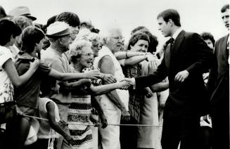 Royal treatment: Prince Andrew greets well-wishers during a visit to Peterborough yesterday