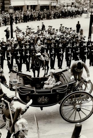 Princess Anne and her husband Capt Mark Pillips arrive by open carriage at St Pauls Cathedral for the Silver Jubilee thanksgiving Service