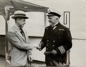 Just before the Prince disembarked at Quebec, The Prince of Wales is here seen shaking hands with Commander E