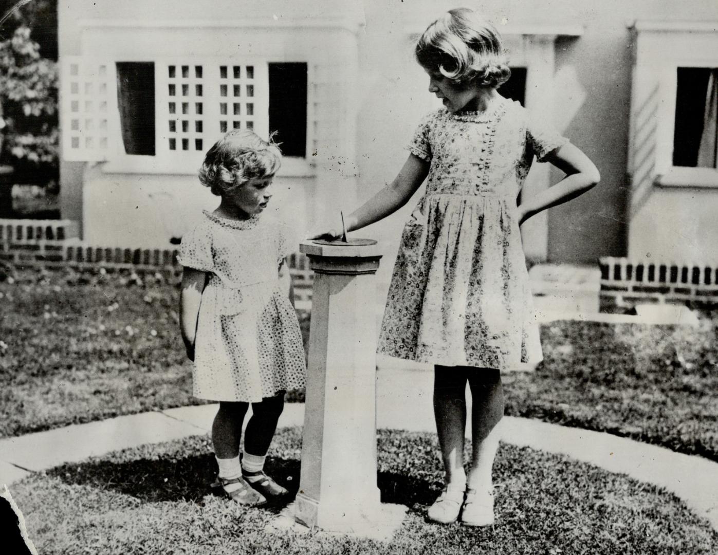 London, England.-Photo Shows Princess Elizabeth (right) and her Sister, Princess Margaret Rose, Daughters of the Duke and Duchess of York, whom rumor (...)