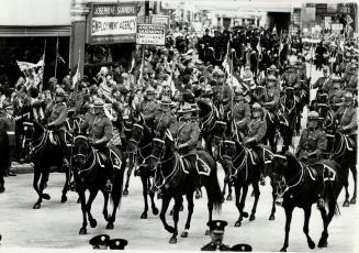 The Royal Canadian Mounted Police led the Queen's golden coach from Buckingham Palace to St