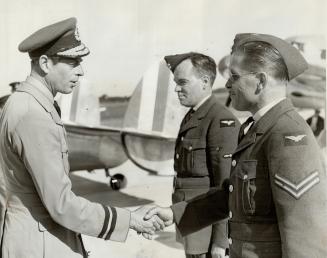 The Duke Shakes hands with drivers of official Card, The duke, having just shaken hands with L