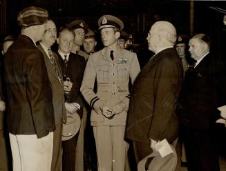 Duke greets war veteran employees, Keen interest in the way military motorized equipment is manufacured was shown today by the Duke of Kent when he visited the General Motors plant at Oshawa today