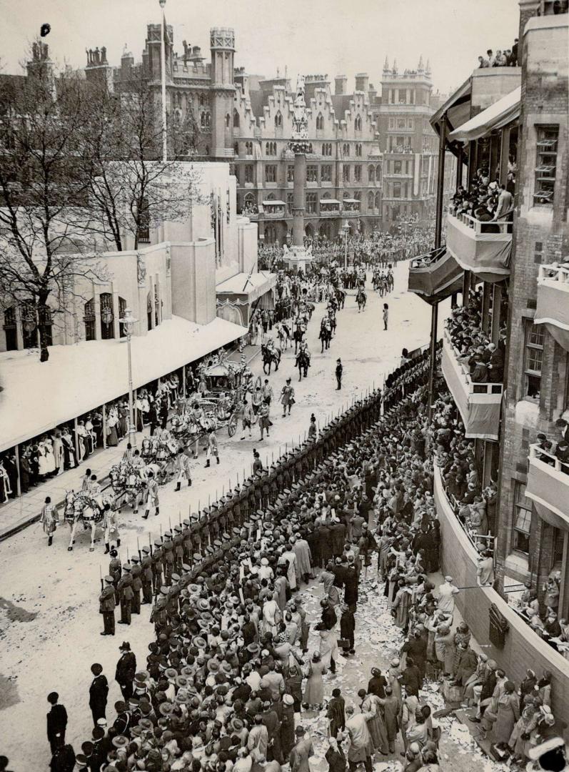 The newly crowned King and Queen in the royal state coach, leave Westminster Abbey, as the return procession to Buckingham Palace begins. Note the spe(...)