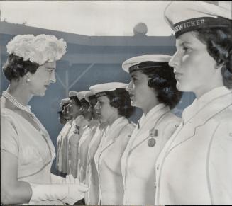 The Duchess of kent made a tour of the tri-services exhibit and stopped to check Wrent Janet Ferguson of Toronto, at left. At right the duchess addresses the crowd. [Incomplete]