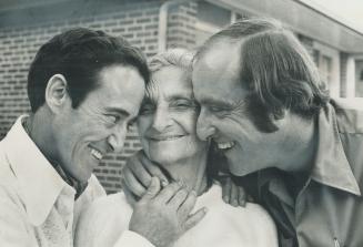 Top Jockey Avelino Gomez (left) and brother Mickey embrace their mother, Jesusa Gomez, 79, who arrived last night from Cuba by way of Spain for her fi(...)