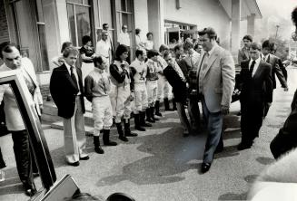 Honor guard: Two dozen jockeys, in racing silks, form honor guard at funeral today for Avelino Gomez who died in weekend spill at Woodbine