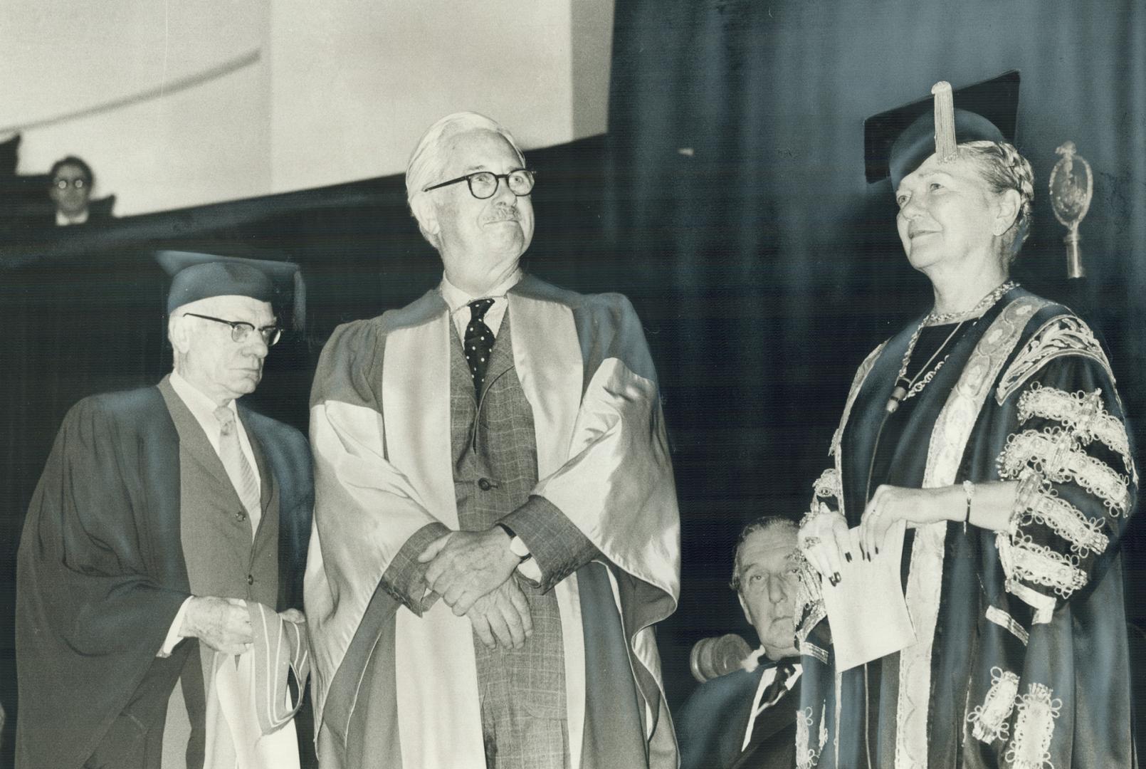 Economist Walter Gordon, a former Liberal cabinet minister, stands with Chancellor Pauline McGibbon of the University of Toronto today to receive an h(...)