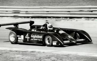 John Graham checks out Cobra March 811 that is being sponsored by Canadian singer-composer Gordon Lightfoot in Sunda's Can-Am race