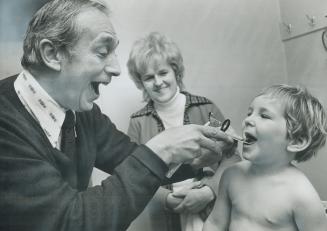 It's smiles all around as Dr. Joe Greenberg examines Sean Finn while Sean's mother, Mrs. Ron. Finn of Brampton, looks on. Key to his practice, the doc(...)