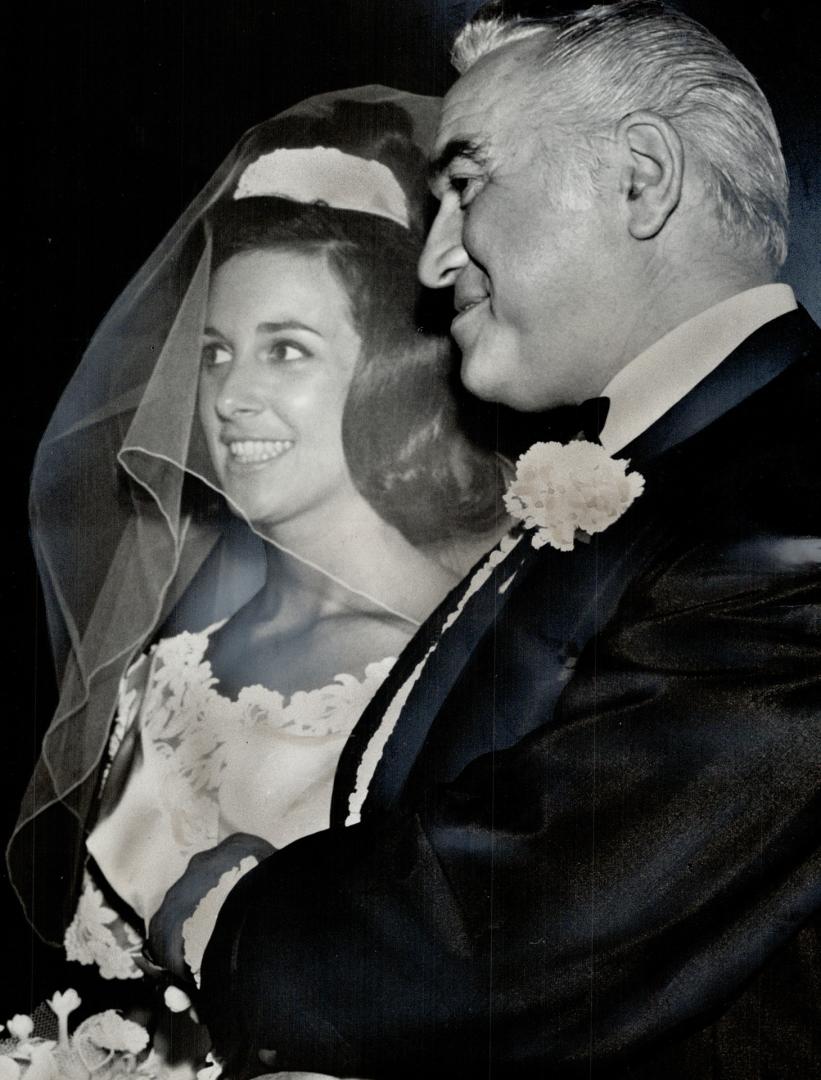 The bride with her father who gave her away at Holy Blossom Ceremony