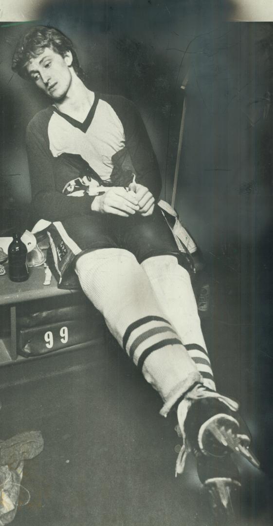 Pressure is finally off: Gretzky stretches out in the Oiler dressing room in a moment of relaxation after the pressure of chasing his 50th goal had subsided