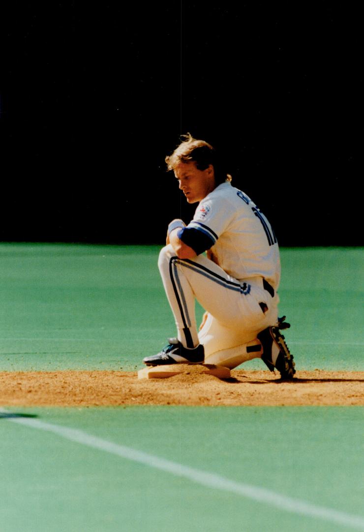 Crime doesn't pay: Kelly Gruber contemplates the error fo his ways after being thrown out trying to steal second base against the Royals yesterday