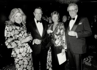 Jane and Peter Eby, and Martha and Hagood Hardy do some socializing