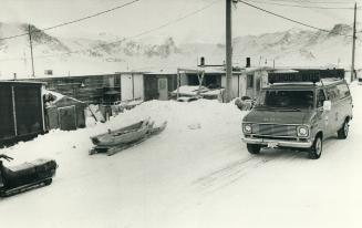 School bus, with Pangnirtung fjord behind