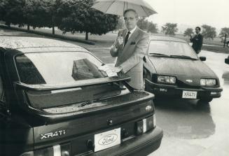 Look at 'er go! Kenneth Harrigan, Ford Canada president, shows off the spoilers that help hold its new pride and joy to the ground at a high speed tha(...)