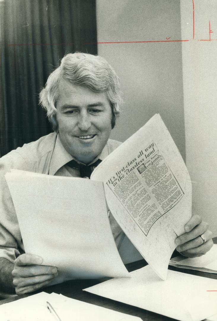 Team Canada coach Billy Harris checks over Star columns by Gary Lautens