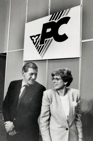 To the wire: Mike Harris, left, and Dianne Cunningham share a laugh on the eve of this afternoon's vote that will make one of them the leader of Ontario's Tories