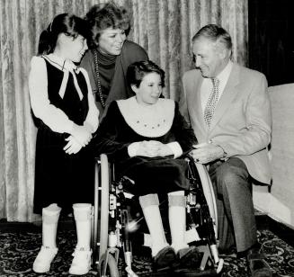 It's all for them: Singer Catherine McKinnon and her husband, Don Harron, chat with Amanda Taylor, 9, and Tracey Ferguson, 12, at the Variety Club luncheon and roast of Harron yesterday